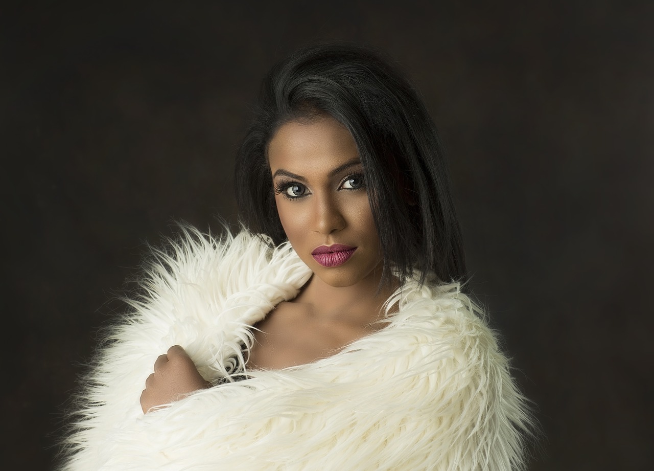 Black or mixed race woman in a white fluffy top